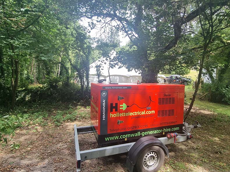 Generator hidden in trees to power a marquee wedding